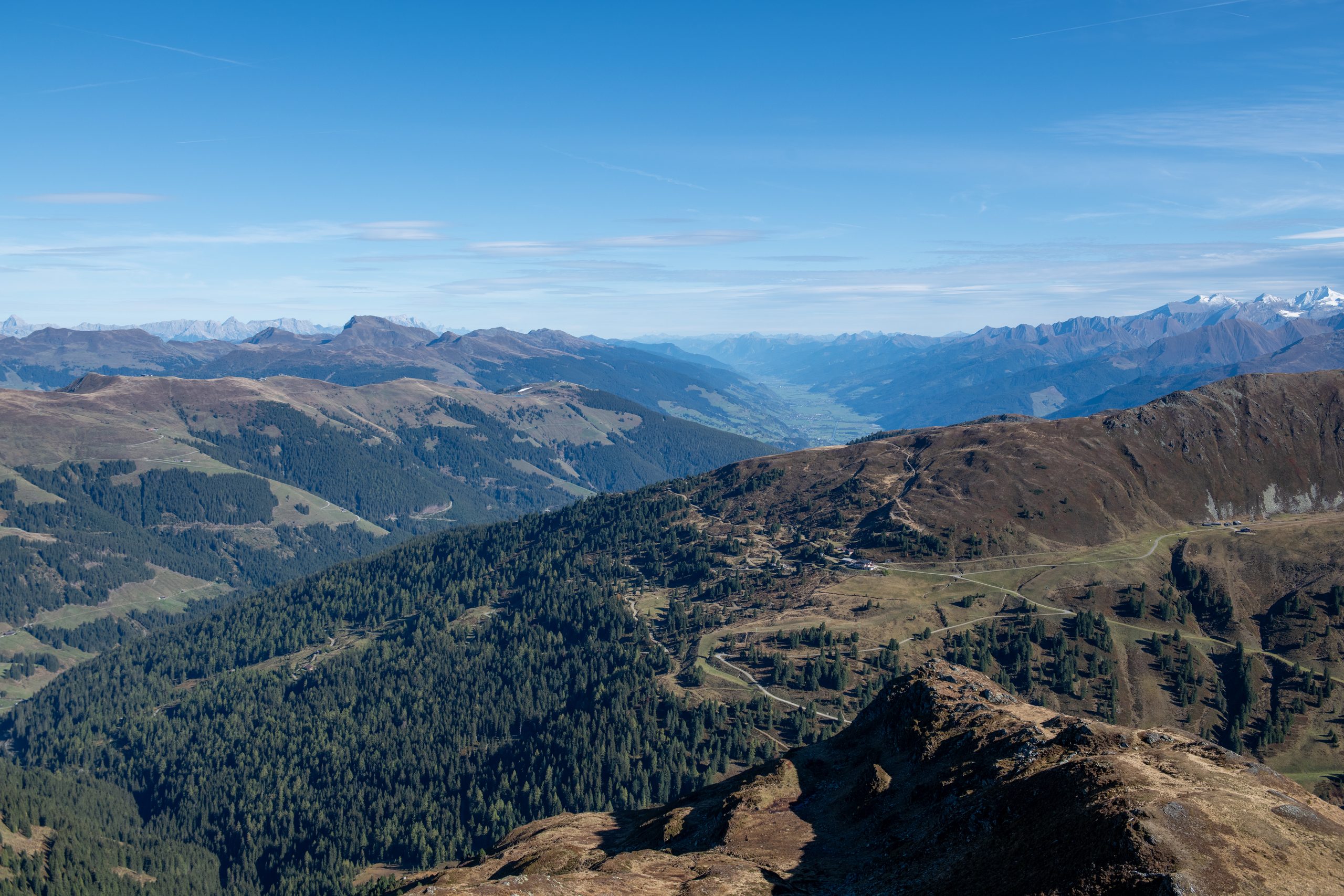 Sunny valley and forests below the Wildkogel
